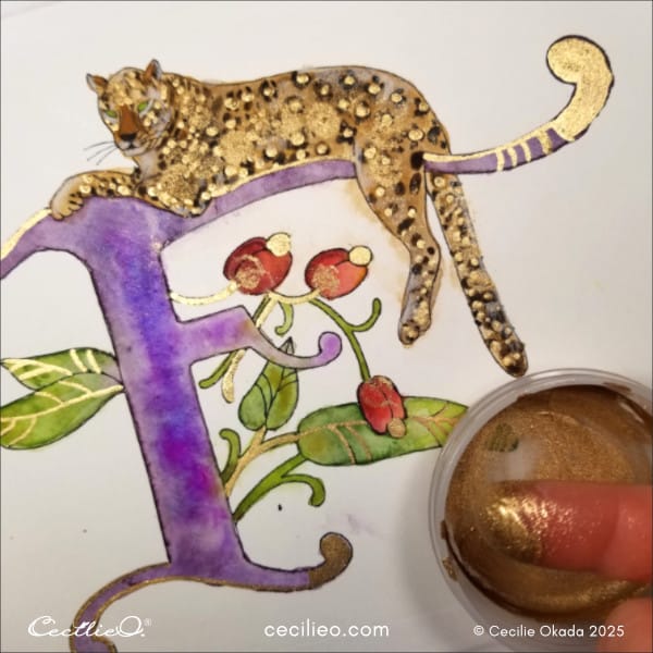 Dabbing gold paint for creative effect onto the leopard.