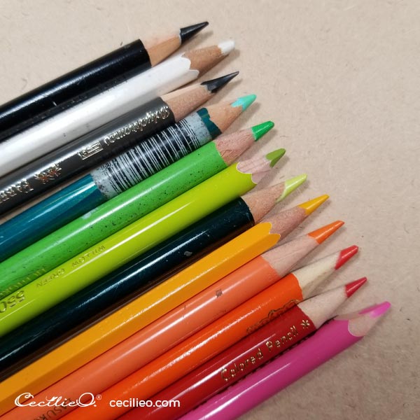 A bunch of colored pencils used for retouching the watercolor butterflies.