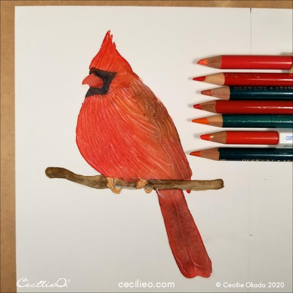 Drawing with multiple red and orange colored pencils.