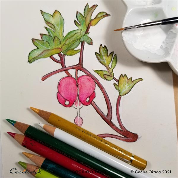 Drawing details on the leaves with white gouache and colored pencils. 