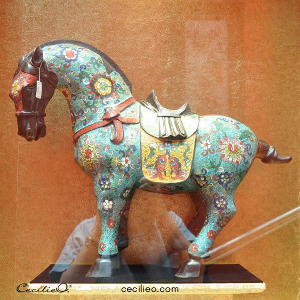 Chinese horse figurine with colorful pattern design.