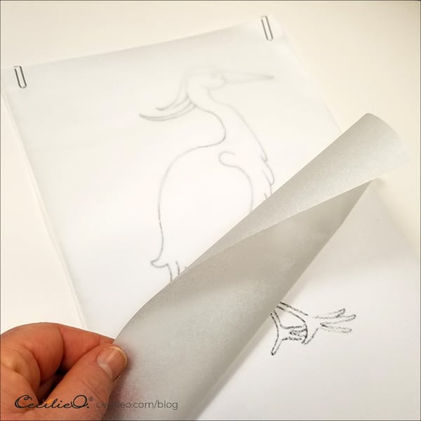 Fasten the tracing paper with paper clips or cello tape to avoid movement.