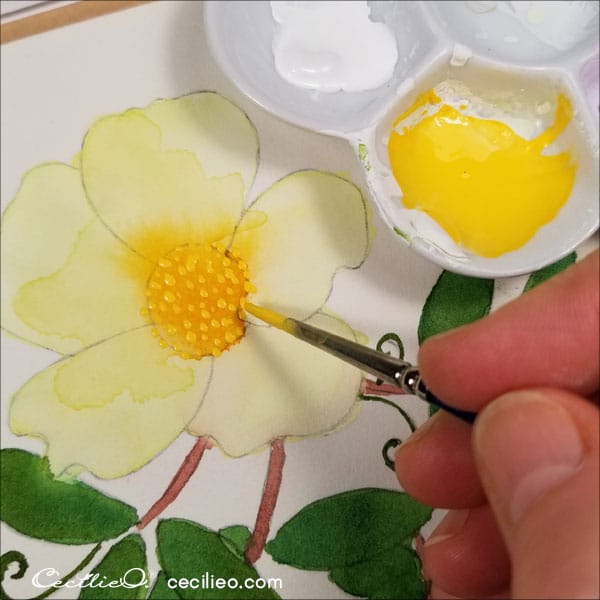 Painting yellow dots in the flower centre