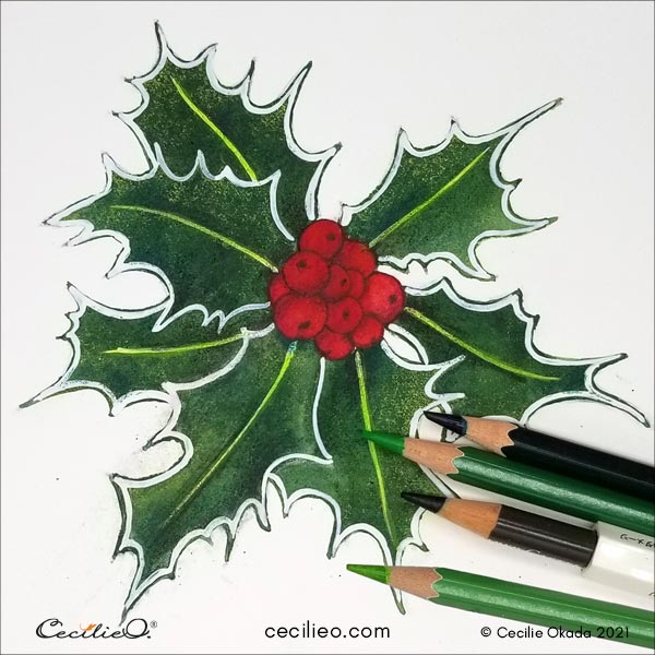 Drawing shades of green with colored pencils on the leaves. 