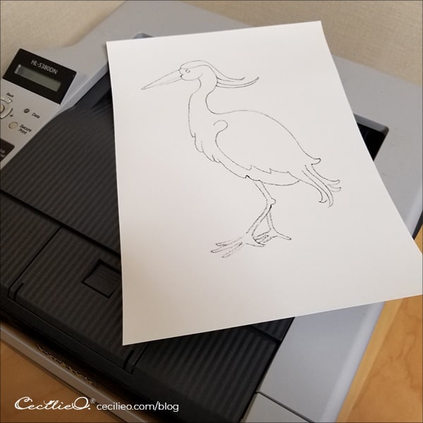 The drawing has been printed directly onto the watercolor paper, using a regular laser printer.
