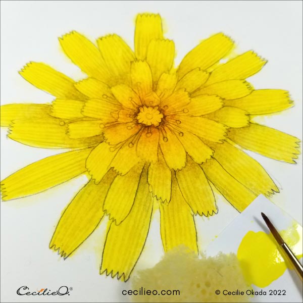 Repainting the flower with lemon yellow and using a sponge to brighten the tips of the petals.